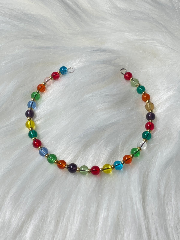  vibrant bracelet featuring a spectrum of multicolored beads on flexible memory wire, the Rainbow Glow Memory Wire Bracelet adds playful elegance to any outfit.