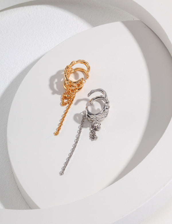  Unleash your style with these unique ear cuffs, featuring a bold tassel design in gold or silver finishes